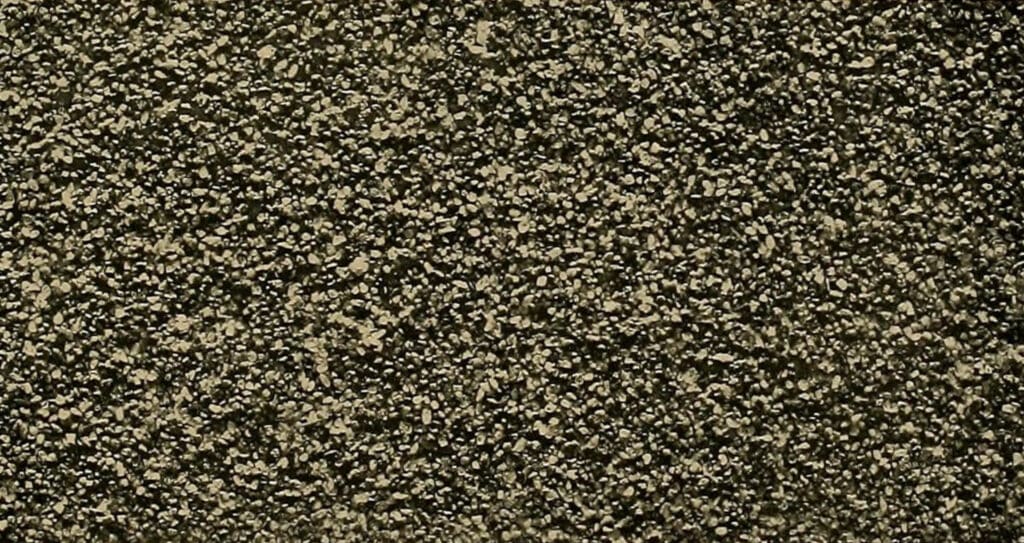 A close-up of soil, providing a detailed look at its granular texture, which is fundamental to the study of soil basics.